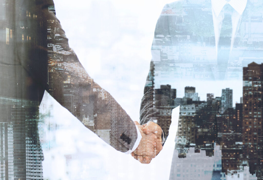 two business people shaking hands.